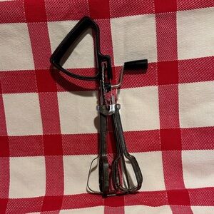 Vintage ECKO (per embossing documented) Metal Egg Beater with a Black Handle.